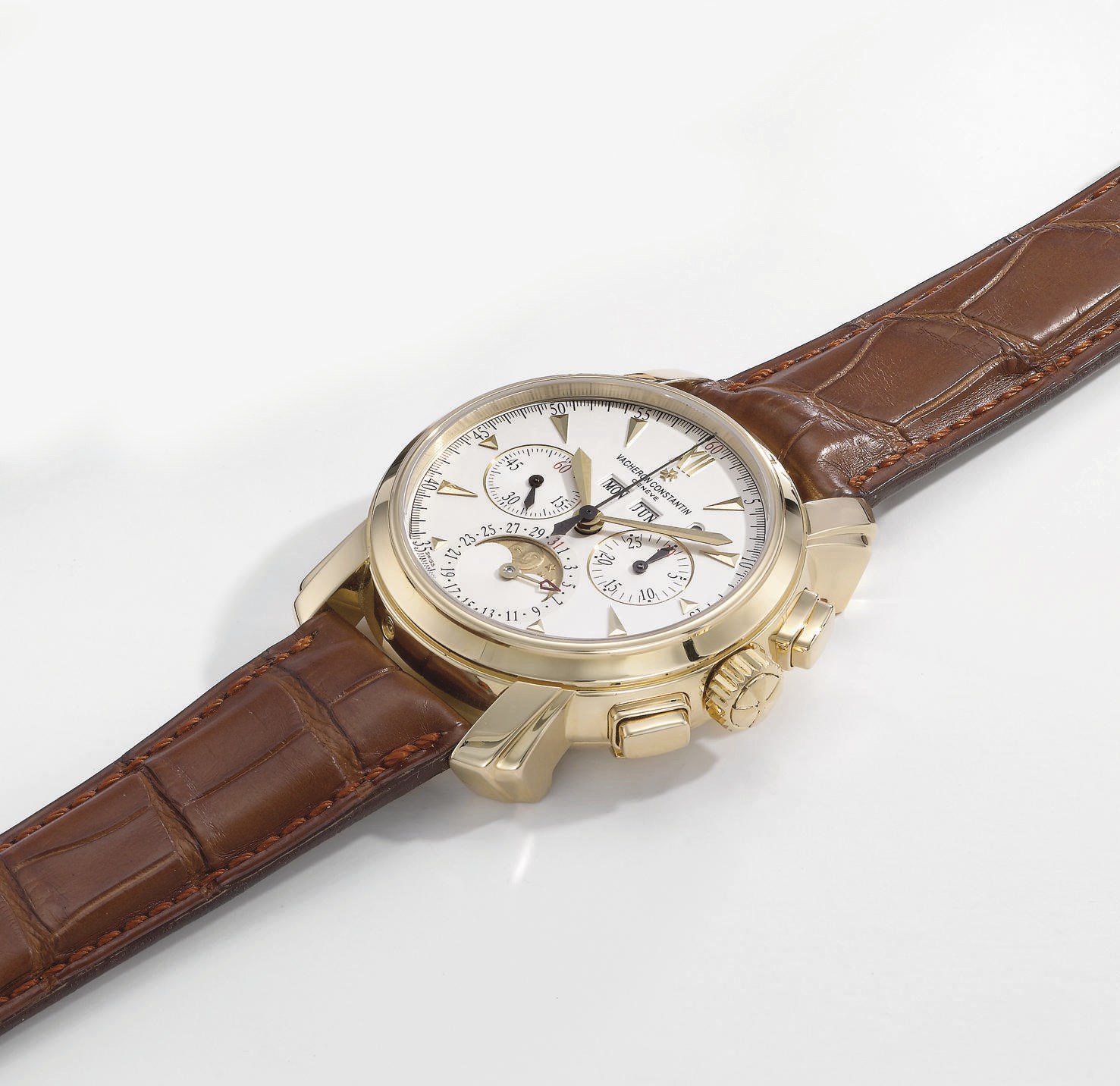 Vacheron Constantin. A very fine and large 18K gold perpetual calendar hinged chronograph wristwatch with leap year window and phases of the moon