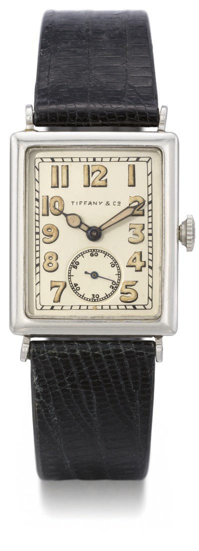 Patek Philippe. A fine platinum rectangular hinged wristwatch with luminous numerals