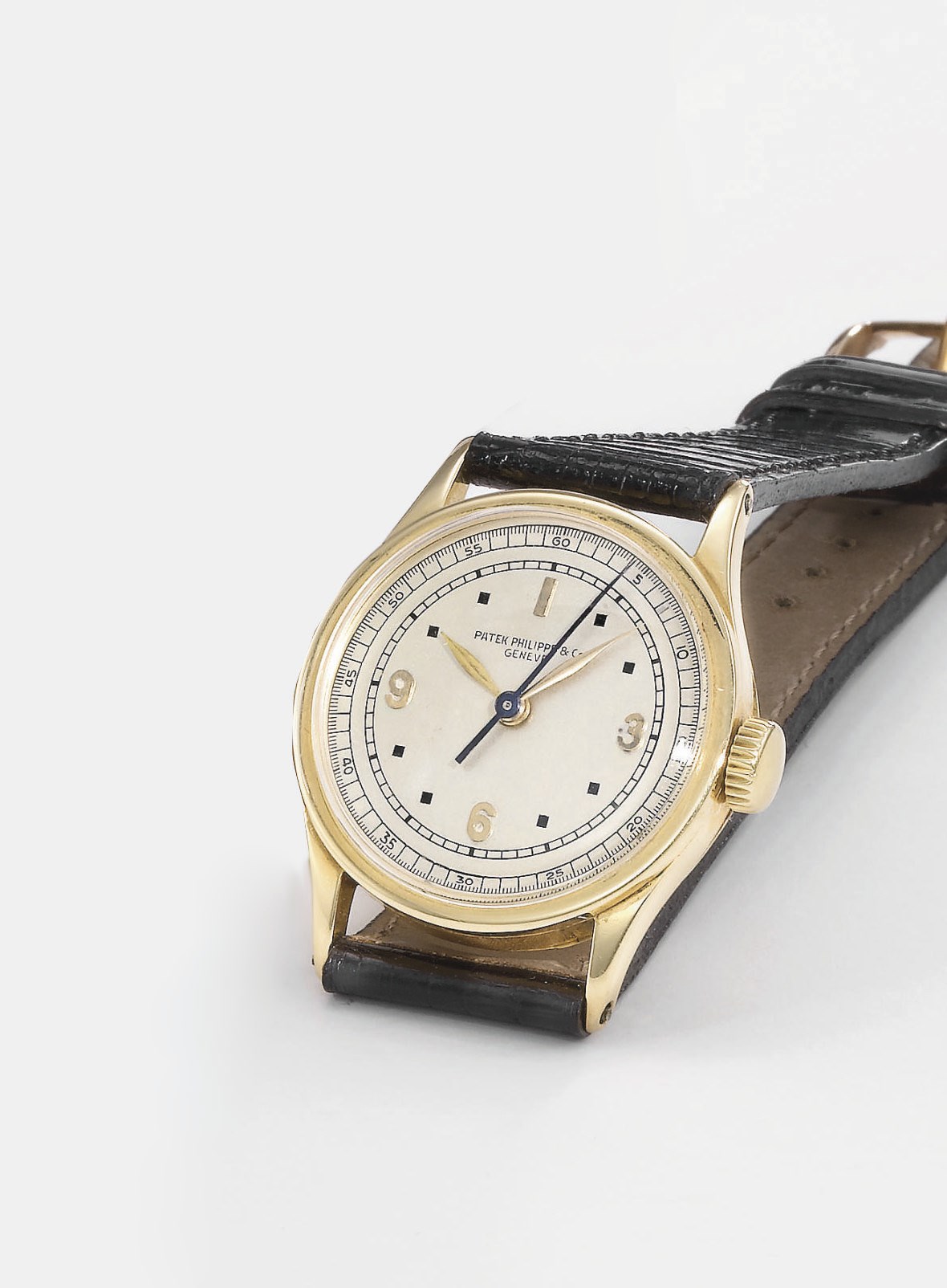 Patek Philippe. A fine and rare 18K gold wristwatch with indirect sweep centre seconds and unusual dial