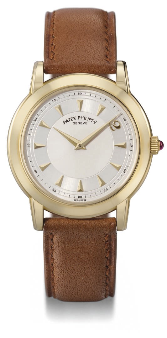 Patek Philippe. A fine 18K gold limited edition self-winding water-resistant wristwatch with original certificate and box, made to celebrate the millenium
