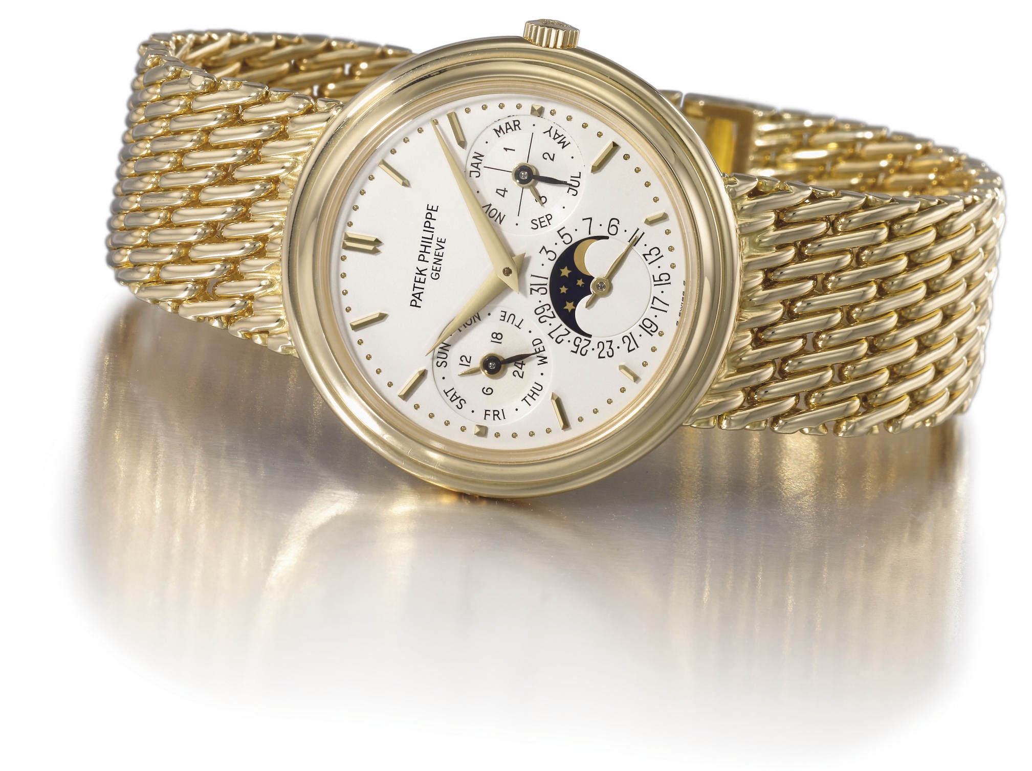 Patek Philippe. A fine 18K gold self-winding perpetual calendar wristwatch with phases of the moon and bracelet