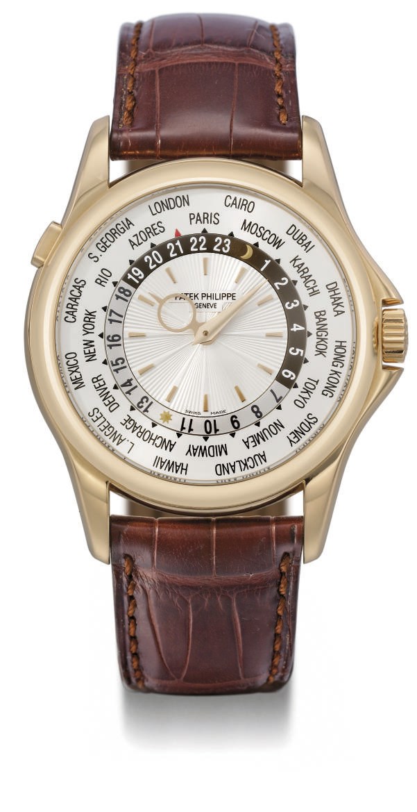 Patek Philippe. A fine 18K pink gold self-winding World Time wristwatch