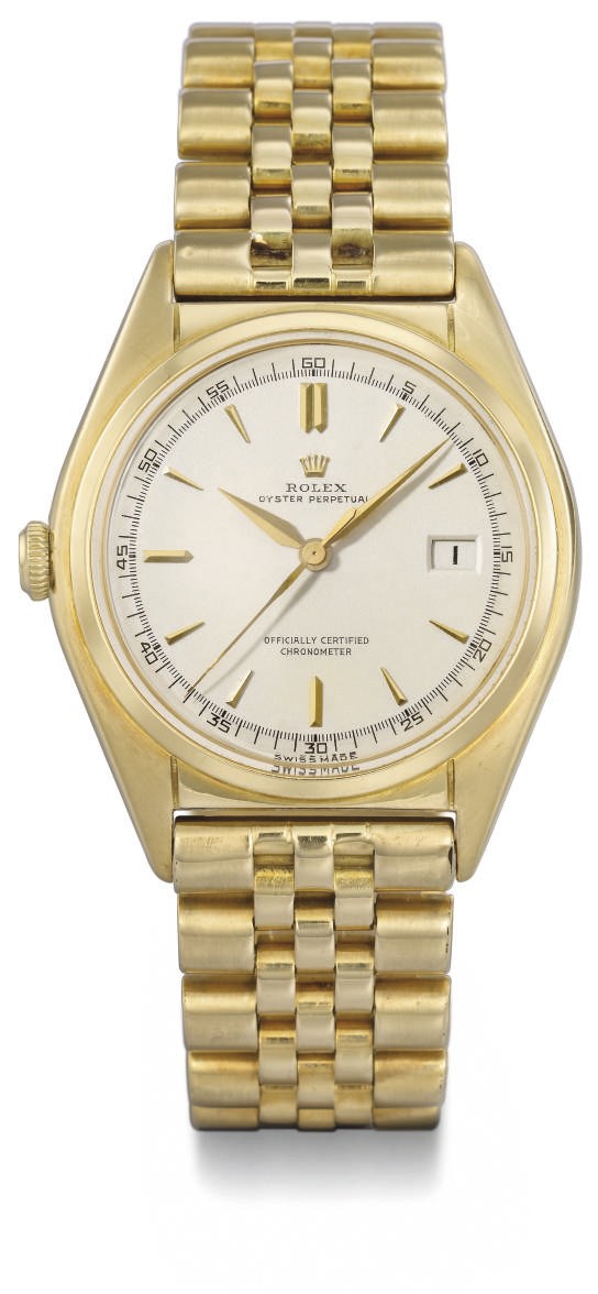Rolex. An unusual 18K gold self-winding water-resistant wristwatch with sweep centre seconds, date and bracelet, transformed into a left-hander model