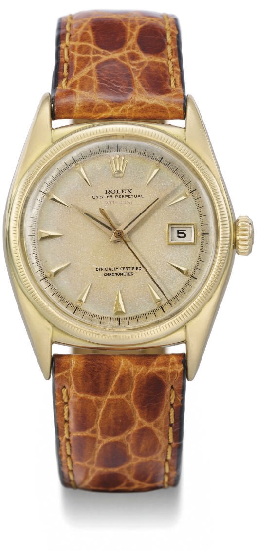 Rolex. An 18K gold self-winding water-resistant wristwatch with date and sweep centre seconds