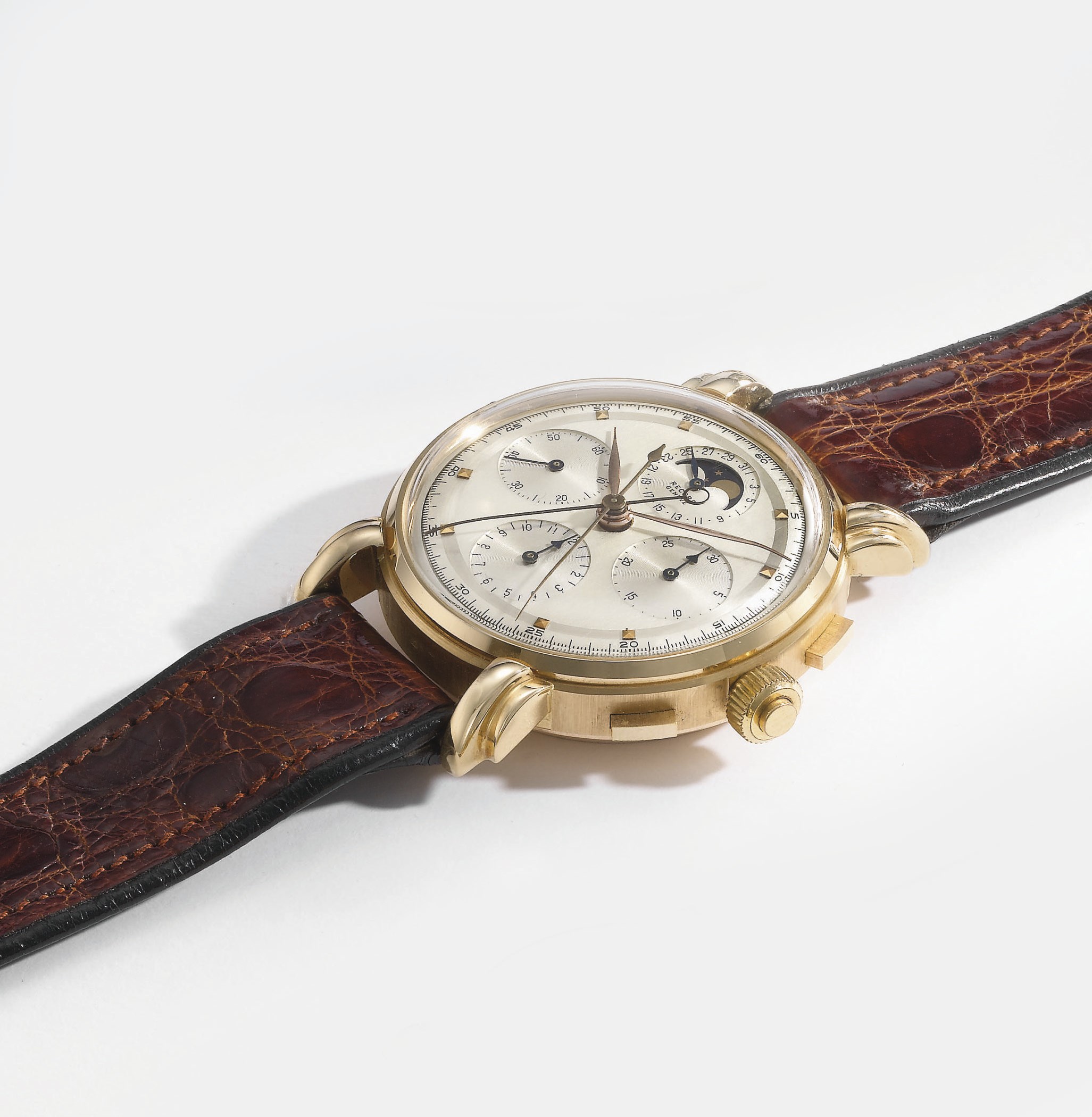 Record. An unusual and large 18K pink gold split seconds chronograph wristwatch with date, phases of the moon and two-tone silvered dial