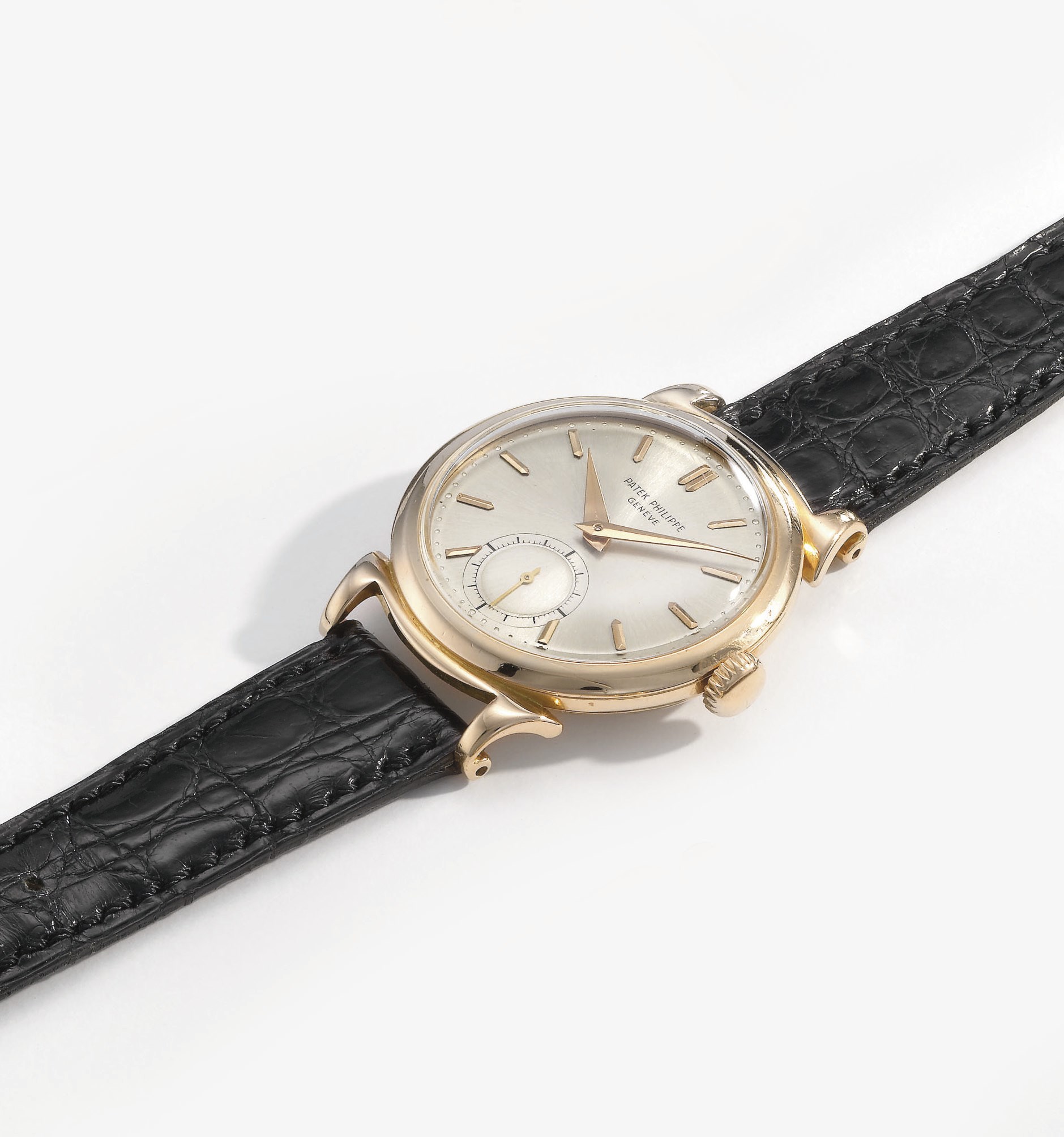 Patek Philippe. A fine and rare 18K pink gold wristwatch with scroll lugs