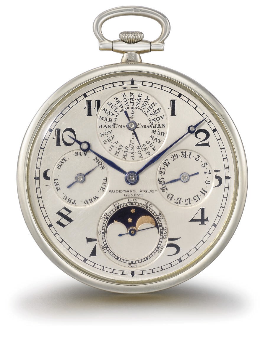 Audemars Piguet. A fine and elegant 18K white and yellow gold openface perpetual calendar keyless lever watch with phases of the moon