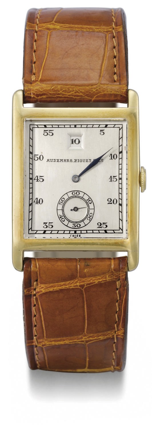 Audemars Piguet. A fine 18K gold rectangular jump hour wristwatch