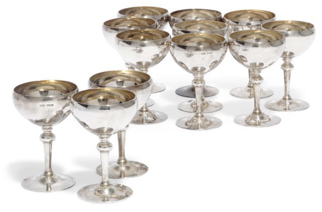 A SET OF TWELVE SILVER SUNDAE CUPS
