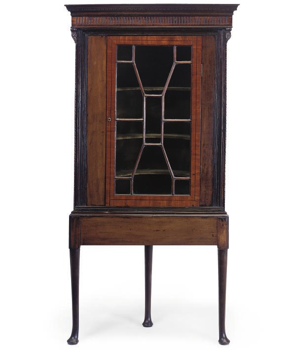A MAHOGANY CORNER CUPBOARD ON STAND