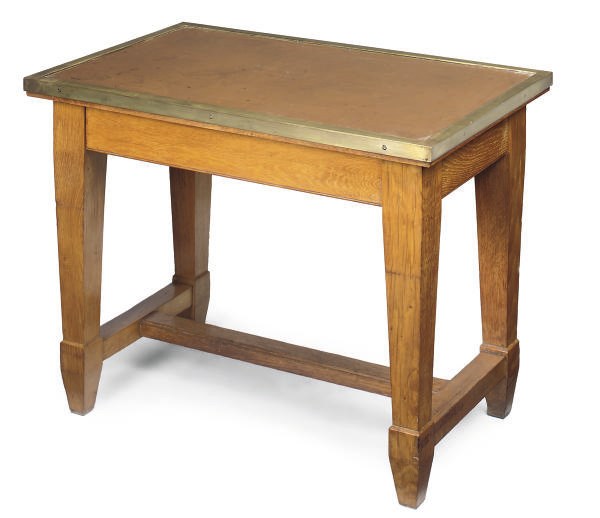 AN OAK AND BRASS MOUNTED CENTRE TABLE