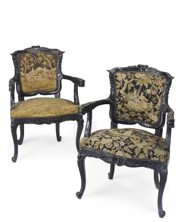 A PAIR OF FRENCH EBONISED ARMCHAIRS
