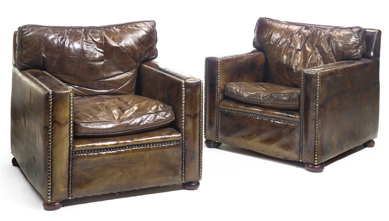 A PAIR OF LEATHER UPHOLSTERED CLUB ARMCHAIRS