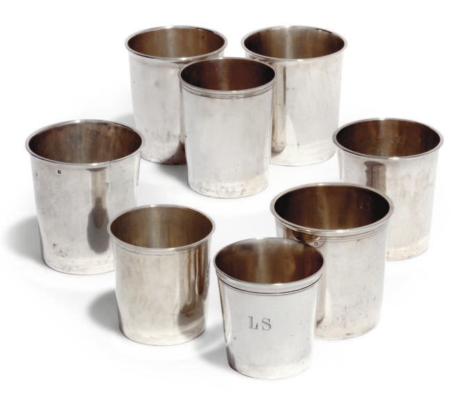 A GROUP OF SEVEN FRENCH 19TH CENTURY SILVER BEAKERS AND ANOTHER ONE PLATED