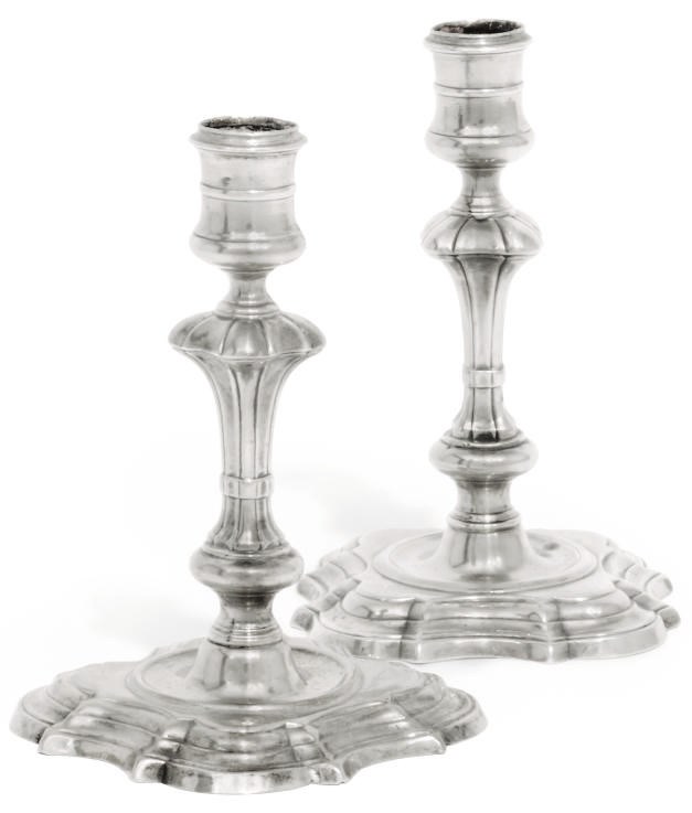 AN 18TH CENTURY SILVER CAST CANDLESTICK