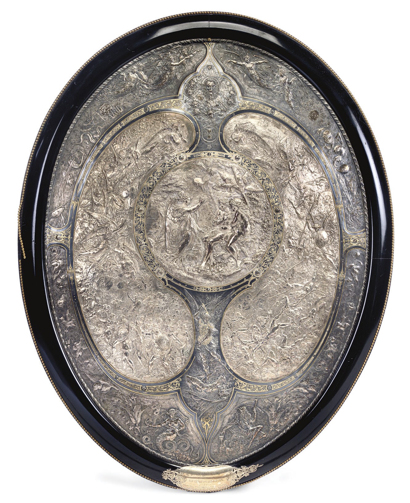 AN ENGLISH ELECTROPLATED WHITE-METAL AND DAMASCENED REPOUSSE OVAL SHIELD