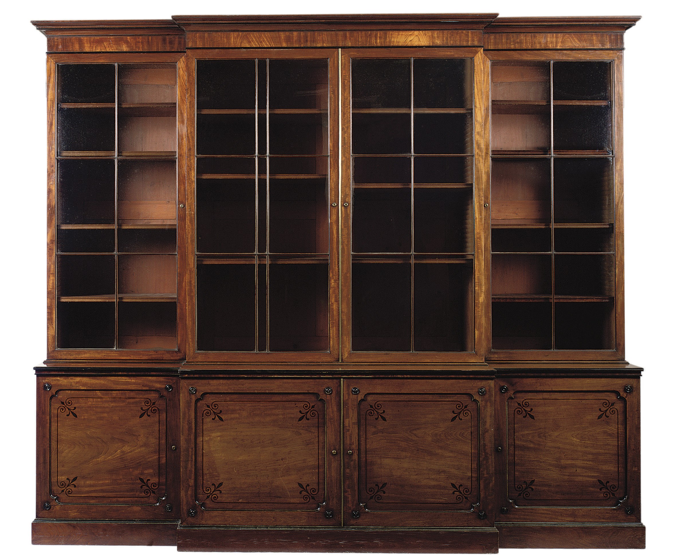 A REGENCY MAHOGANY AND EBONY-INLAID BREAKFRONT BOOKCASE