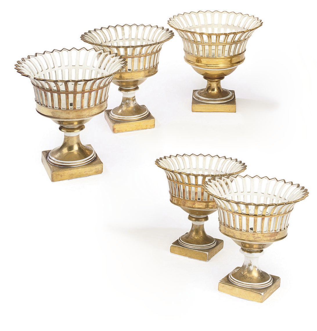 FIVE PARIS PORCELAIN PIERCED BASKETS ON STANDS
