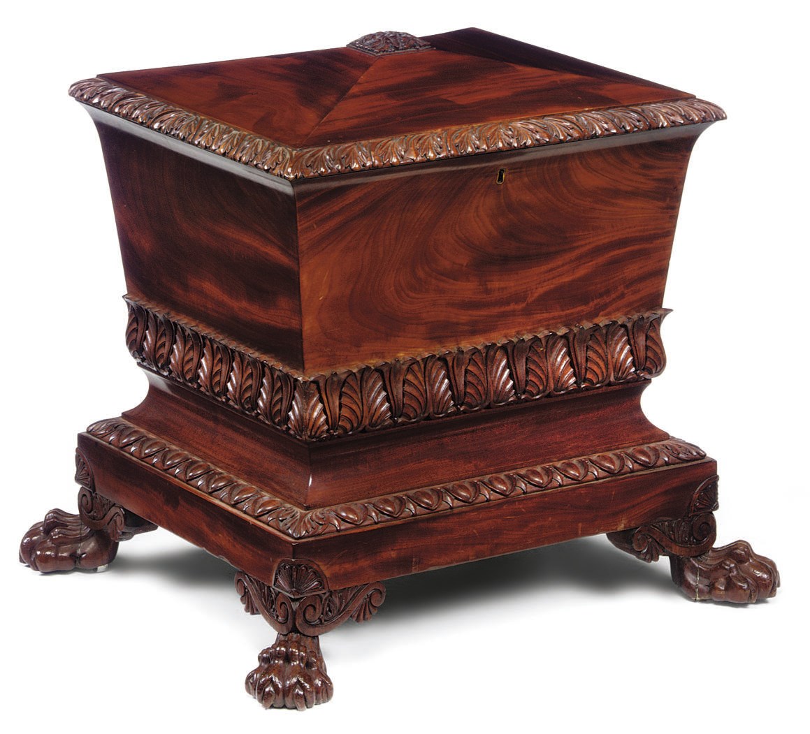 A GEORGE IV CARVED MAHOGANY WINE COOLER