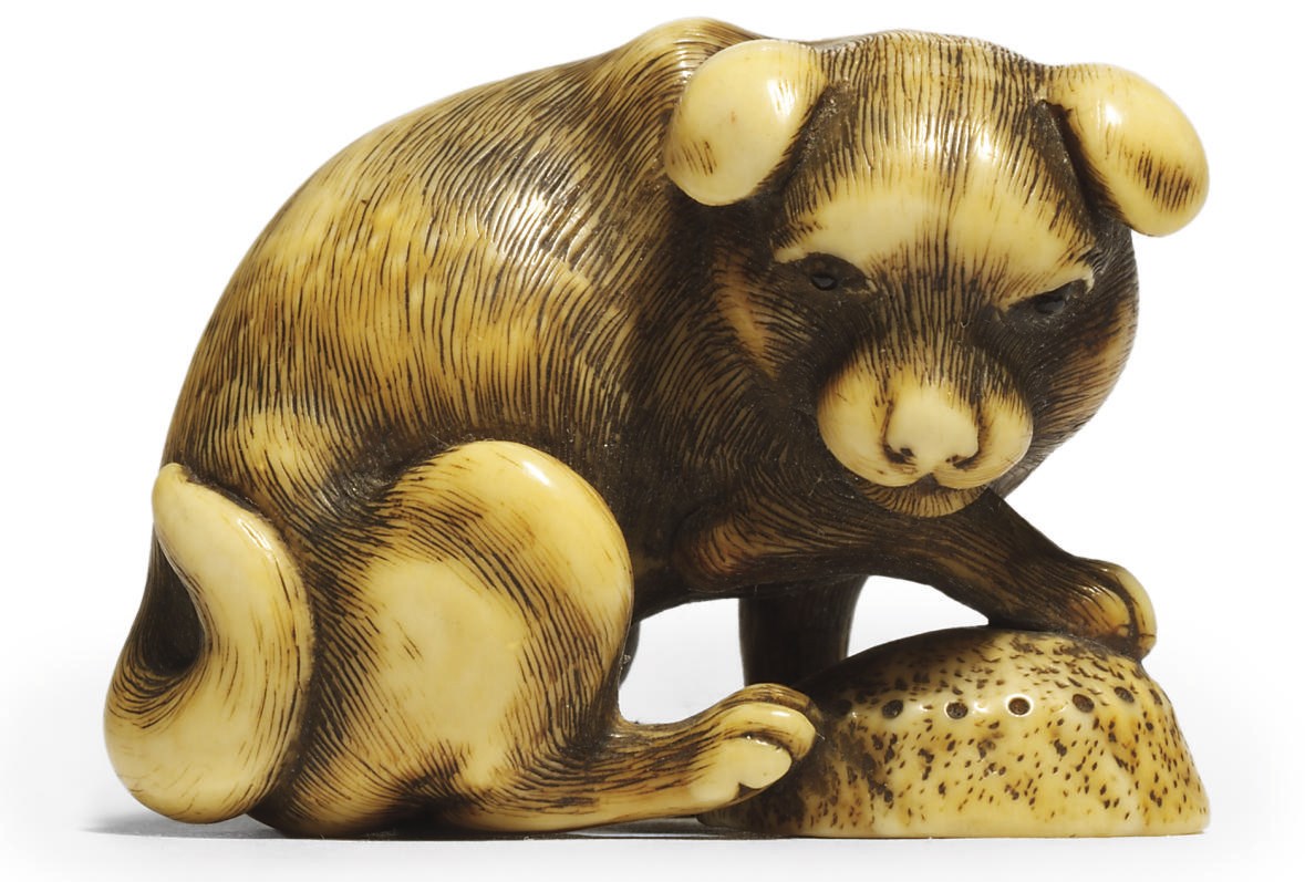 AN IVORY NETSUKE