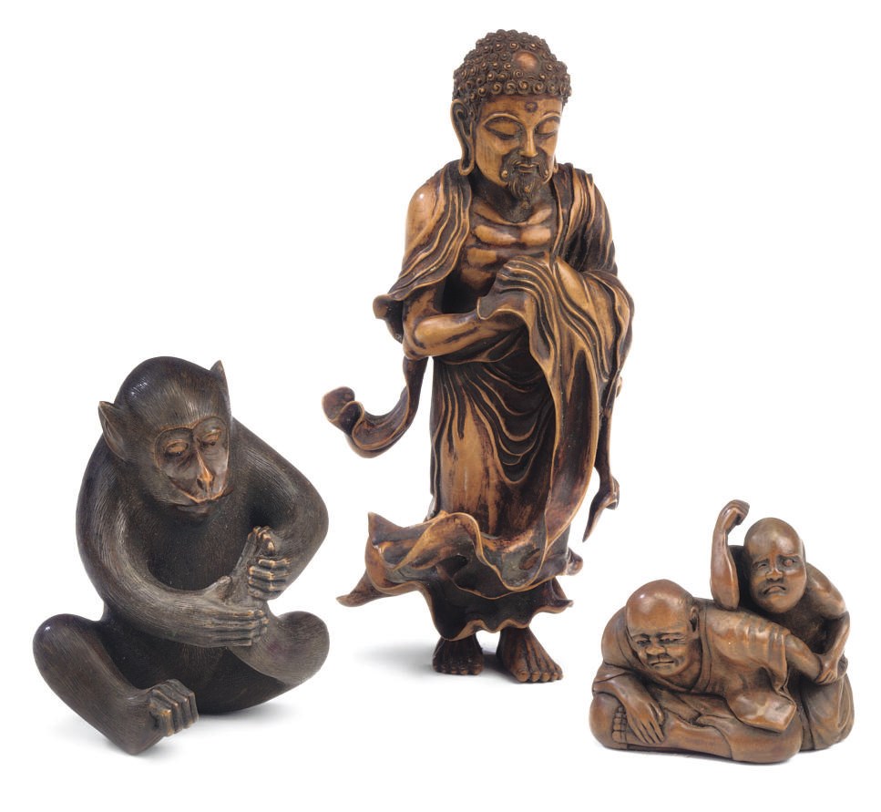 A WOOD OKIMONO OF A BLIND MASSEUR