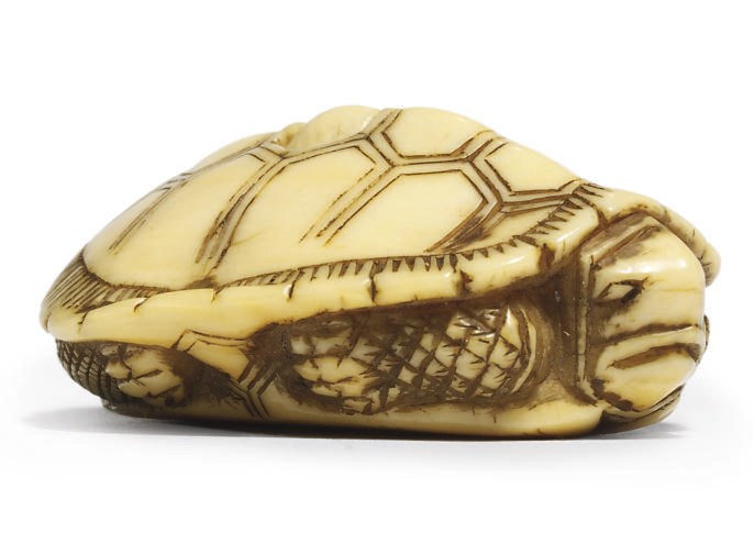 AN IVORY NETSUKE