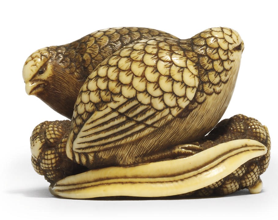 AN IVORY NETSUKE