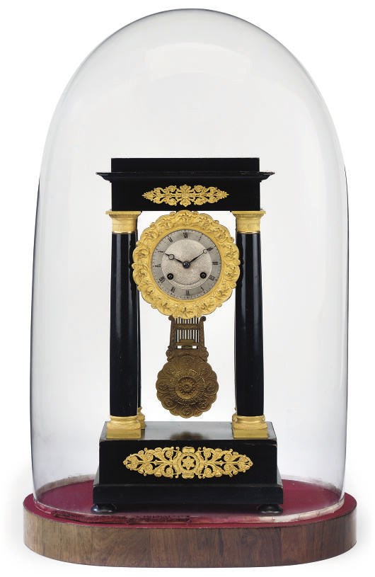A FRENCH ORMOLU-MOUNTED EBONISED STRIKING EIGHT DAY PORTICO CLOCK