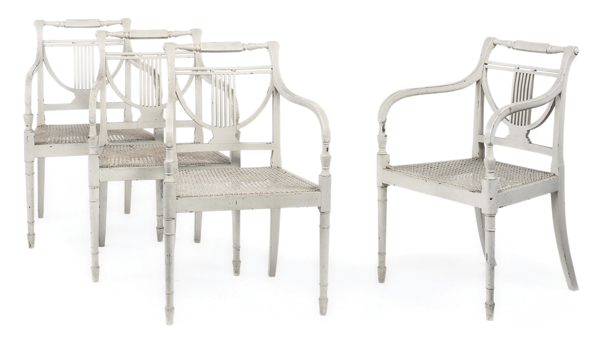 A SET OF FOUR GEORGE III WHITE-PAINTED ARMCHAIRS