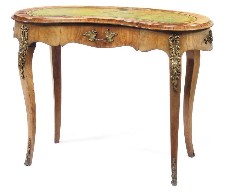 A VICTORIAN ORMOLU-MOUNTED WALNUT KIDNEY-SHAPED WRITING TABLE