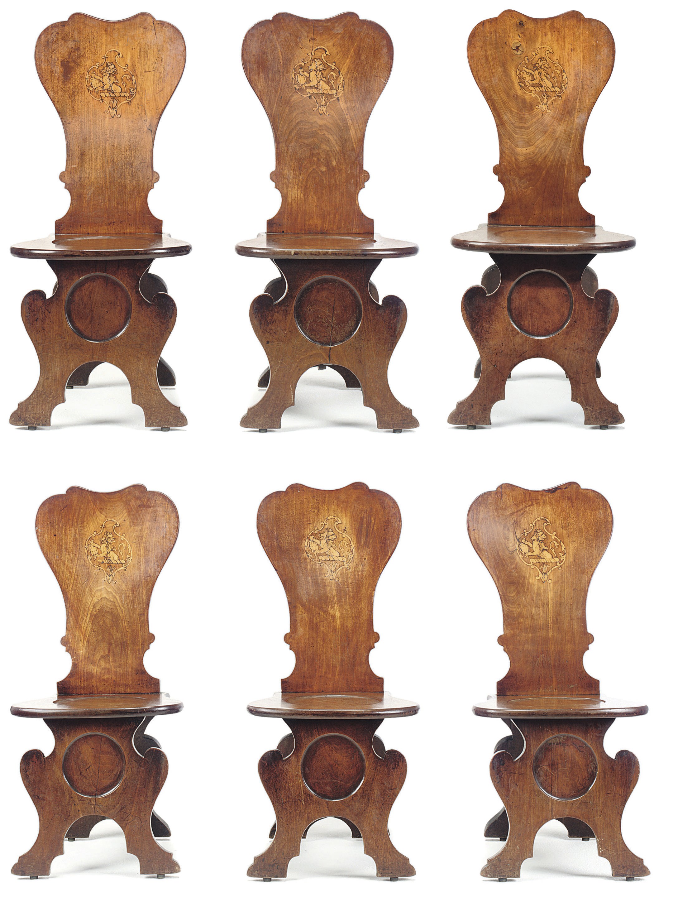 A SET OF SIX GEORGE II MAHOGANY AND ARMORIAL MARQUETRY HALL CHAIRS
