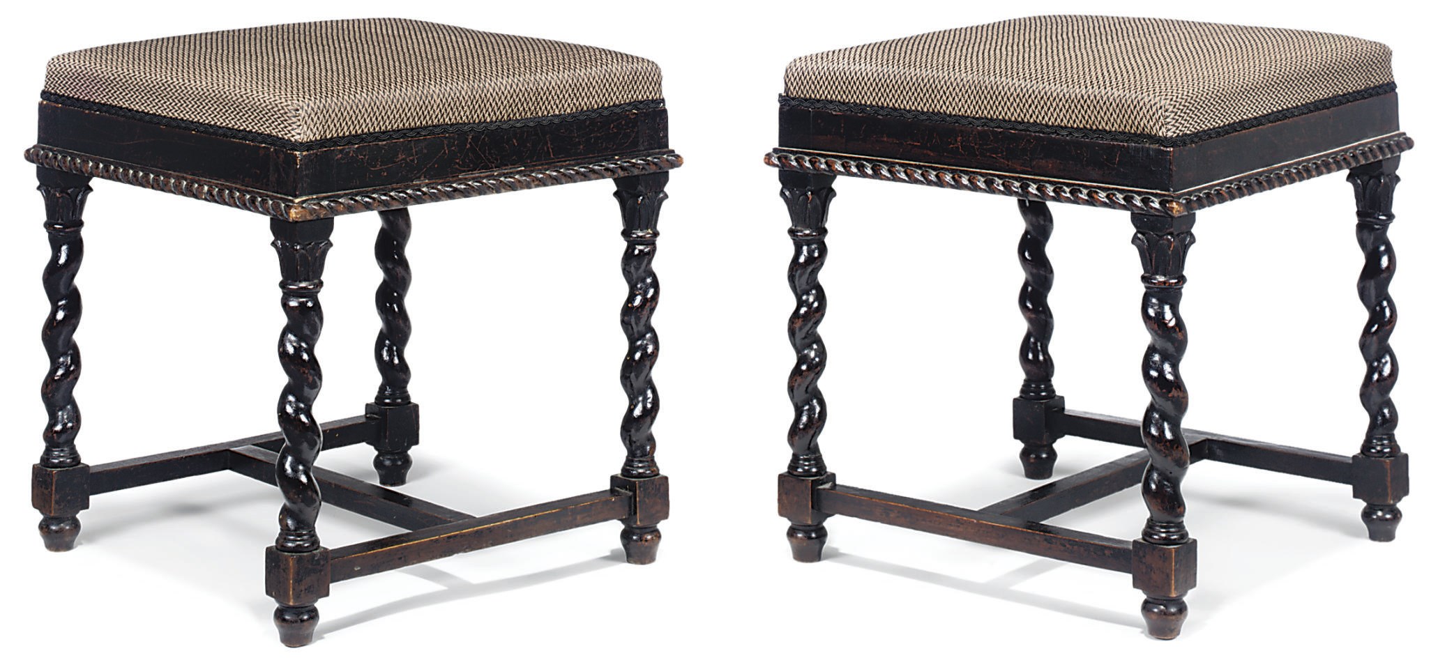 A PAIR OF ANTIQUARIAN EBONISED MAHOGANY STOOLS