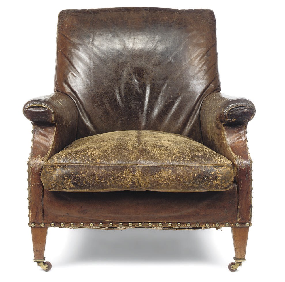 A VICTORIAN WALNUT LIBRARY ARMCHAIR