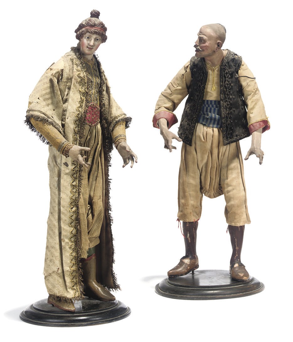 A PAIR OF NEAPOLITAN POLYCHROME TERRACOTTA AND WOOD CRECHE FIGURES OF ORIENTALS