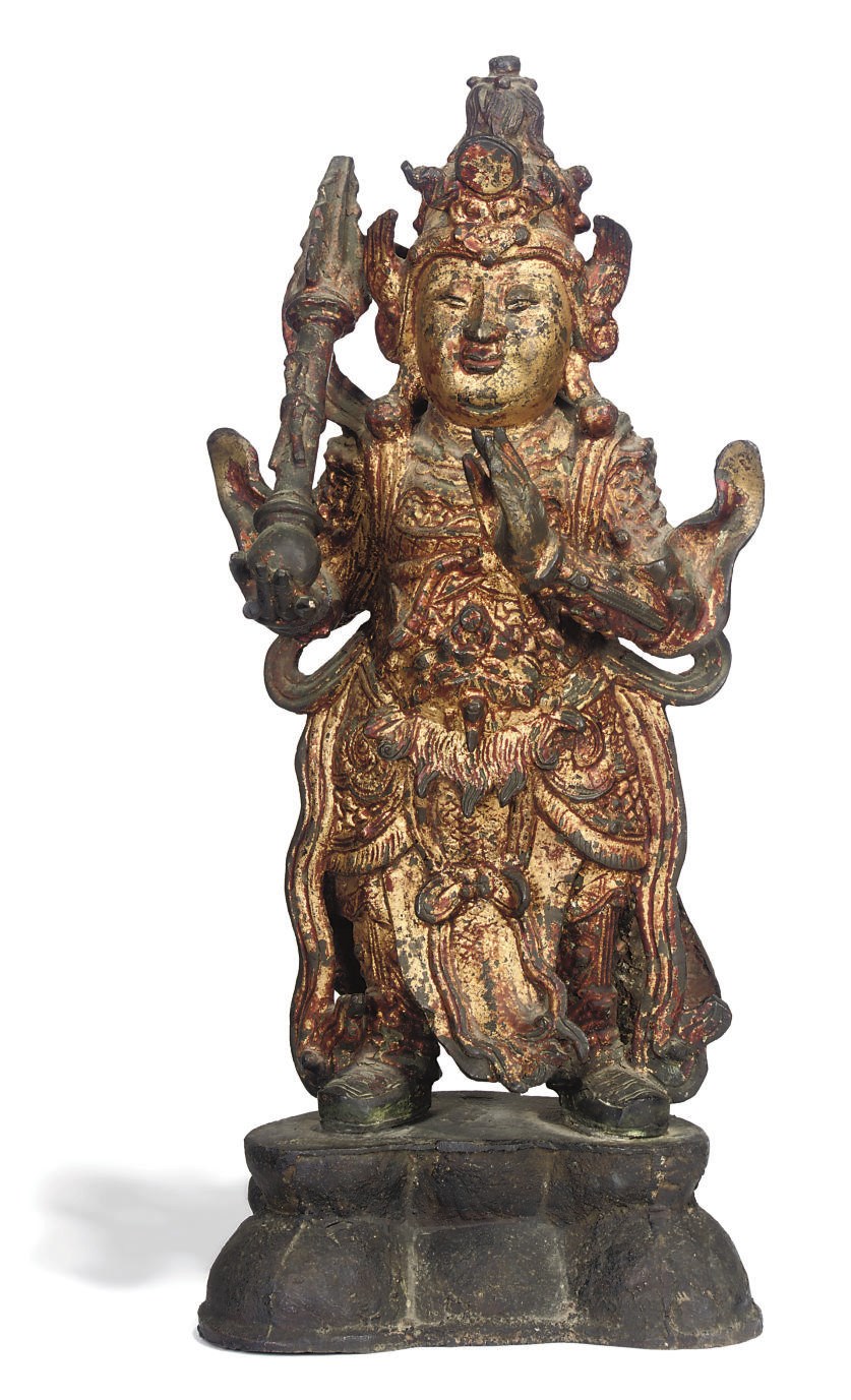 A CHINESE GILT-LACQUERED BRONZE GUARDIAN FIGURE