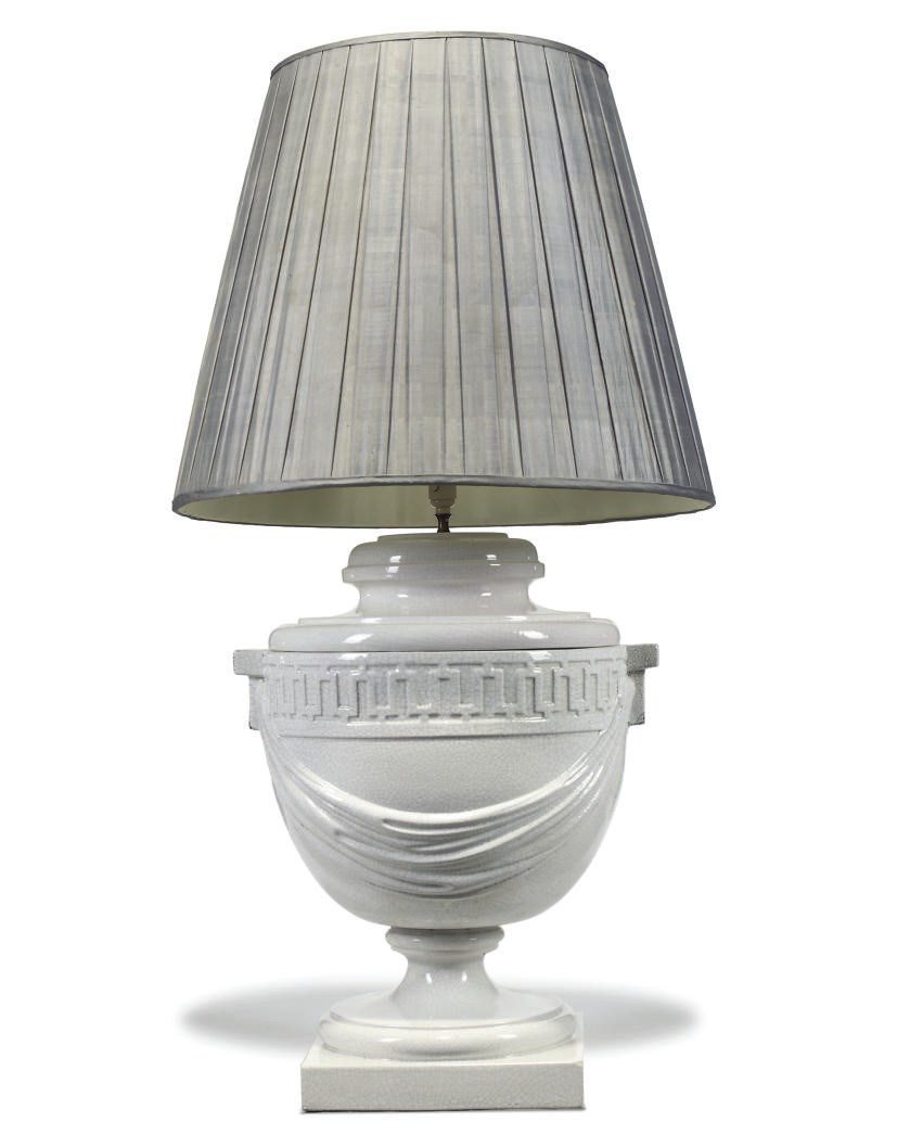 A WHITE-GLAZED POTTERY LAMP
