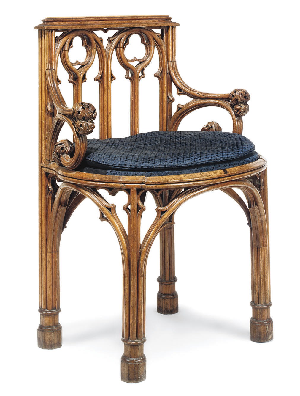 A GEORGE IV GOTHIC ELM ARMCHAIR