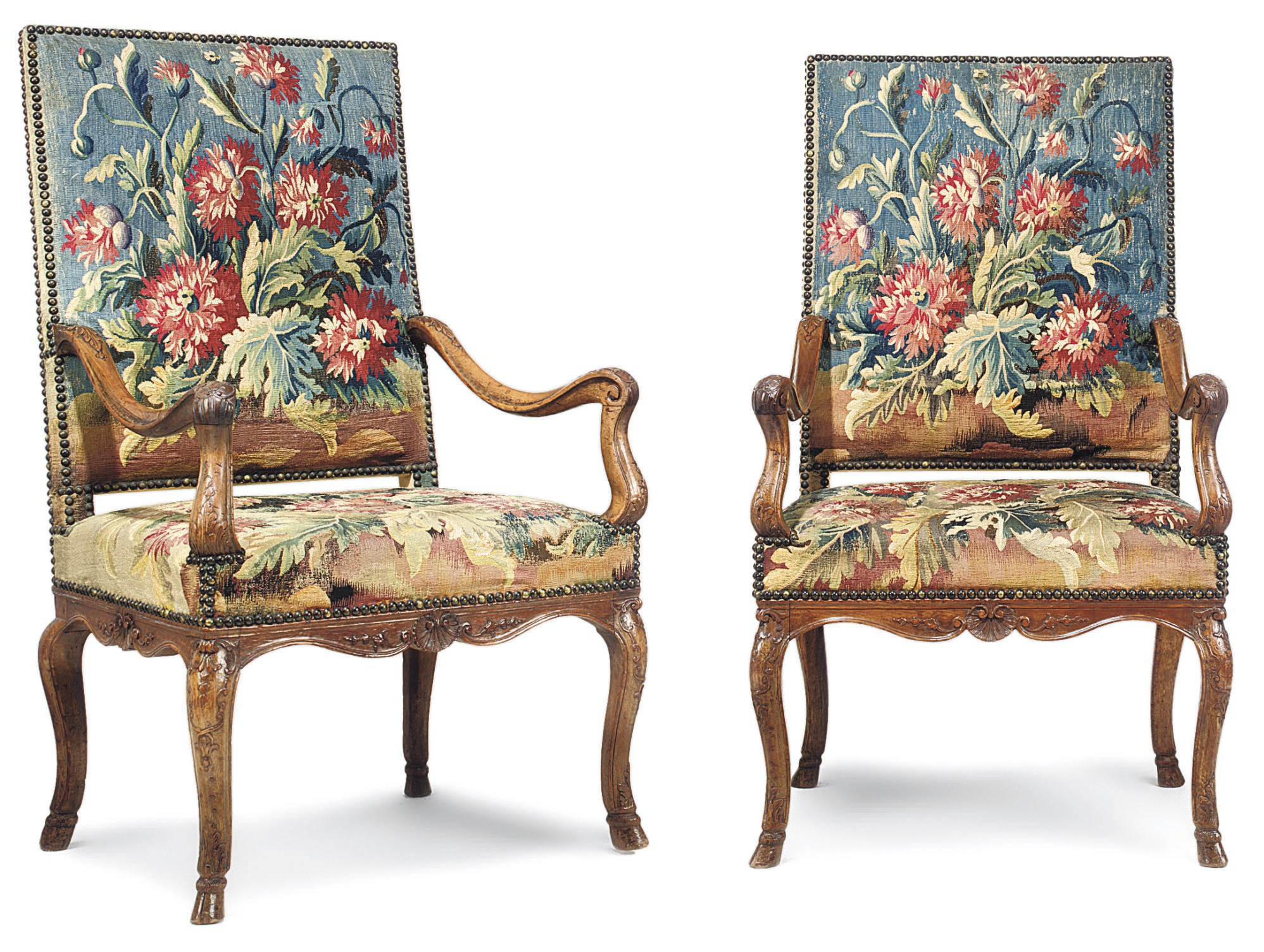 A PAIR OF REGENCE WALNUT FAUTEUILS