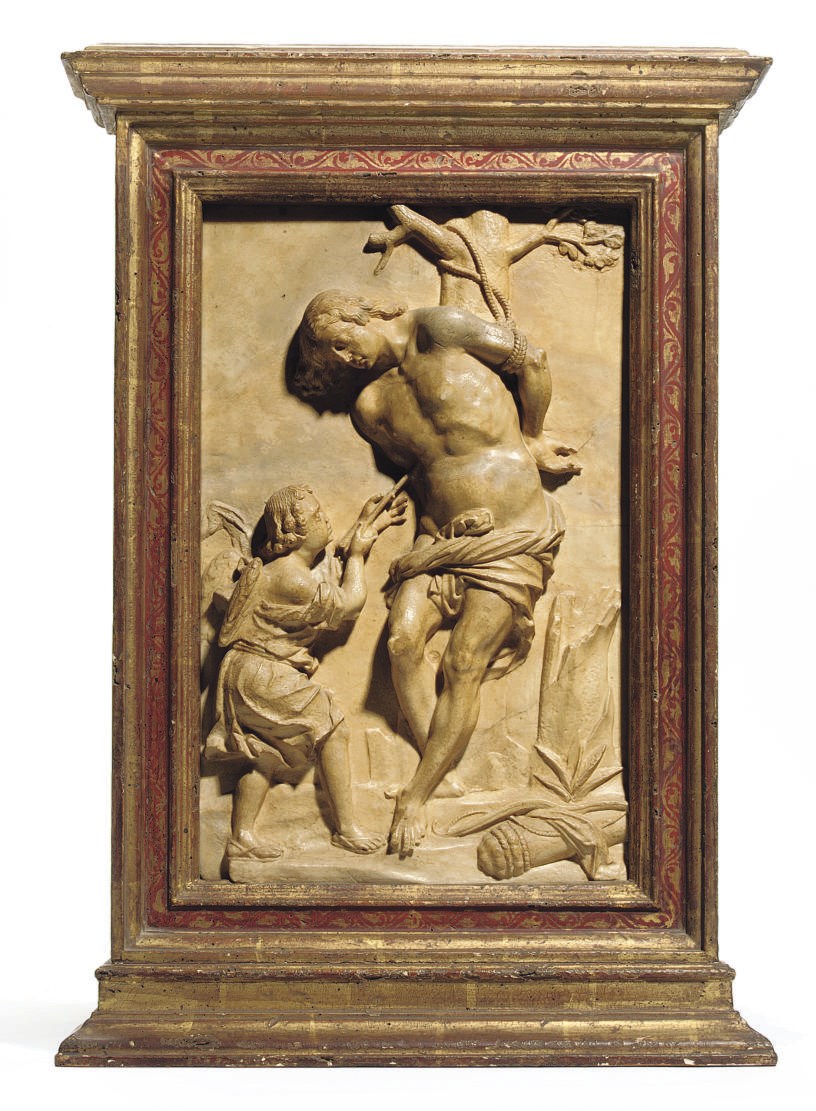 A CARVED ALABASTER RELIEF OF ST SEBASTIAN AND AN ANGEL