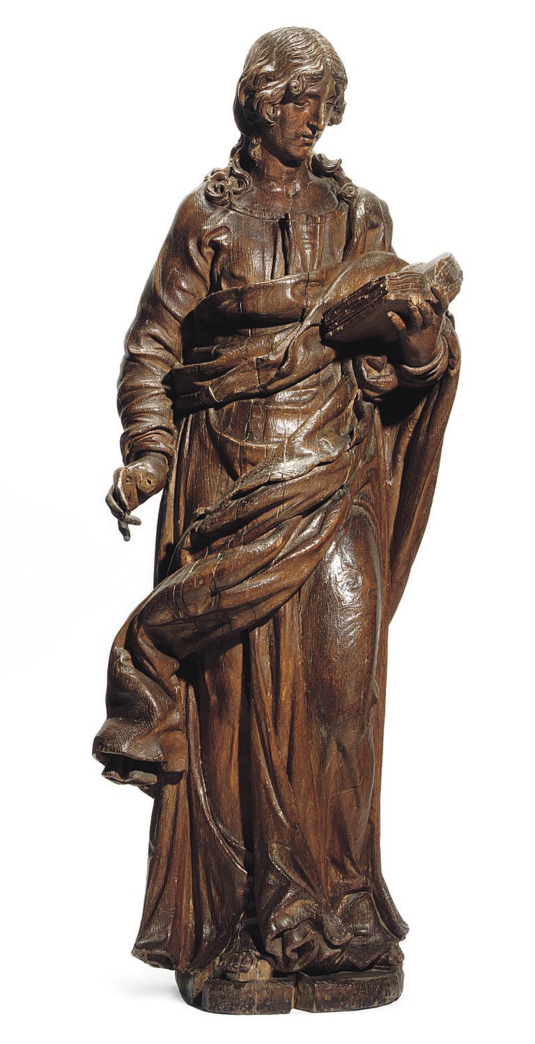 AN ITALIAN CARVED WOOD FIGURE OF AN EVANGELIST