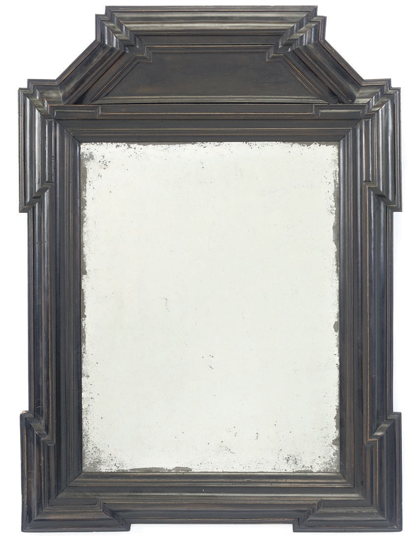 A NORTH EUROPEAN EBONISED MIRROR