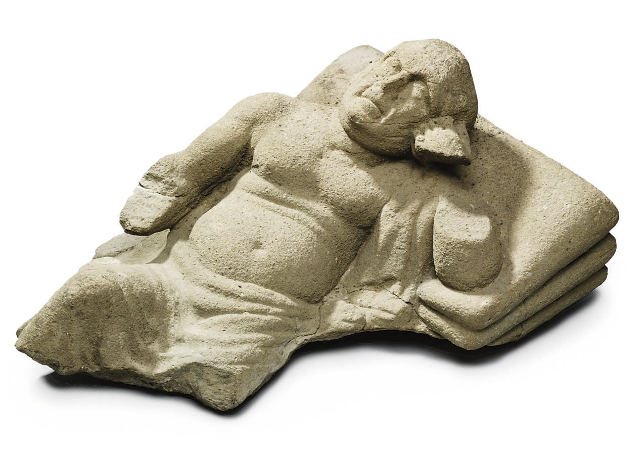 AN ETRUSCAN TUFA CINERARIUM LID