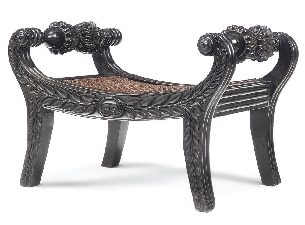 AN ANGLO-INDIAN EBONY FOOTSTOOL