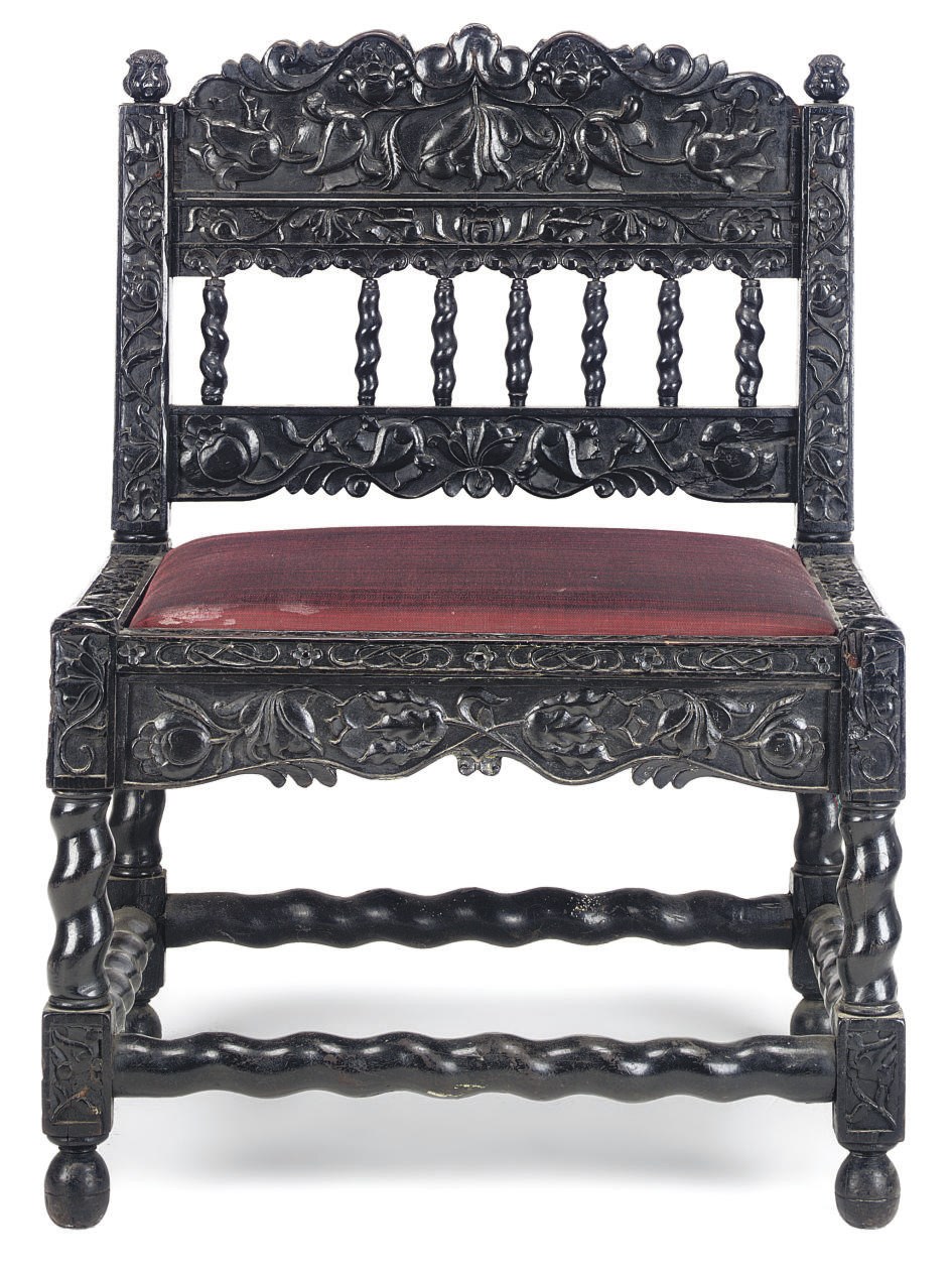 AN INDIAN EBONY LOW CHAIR