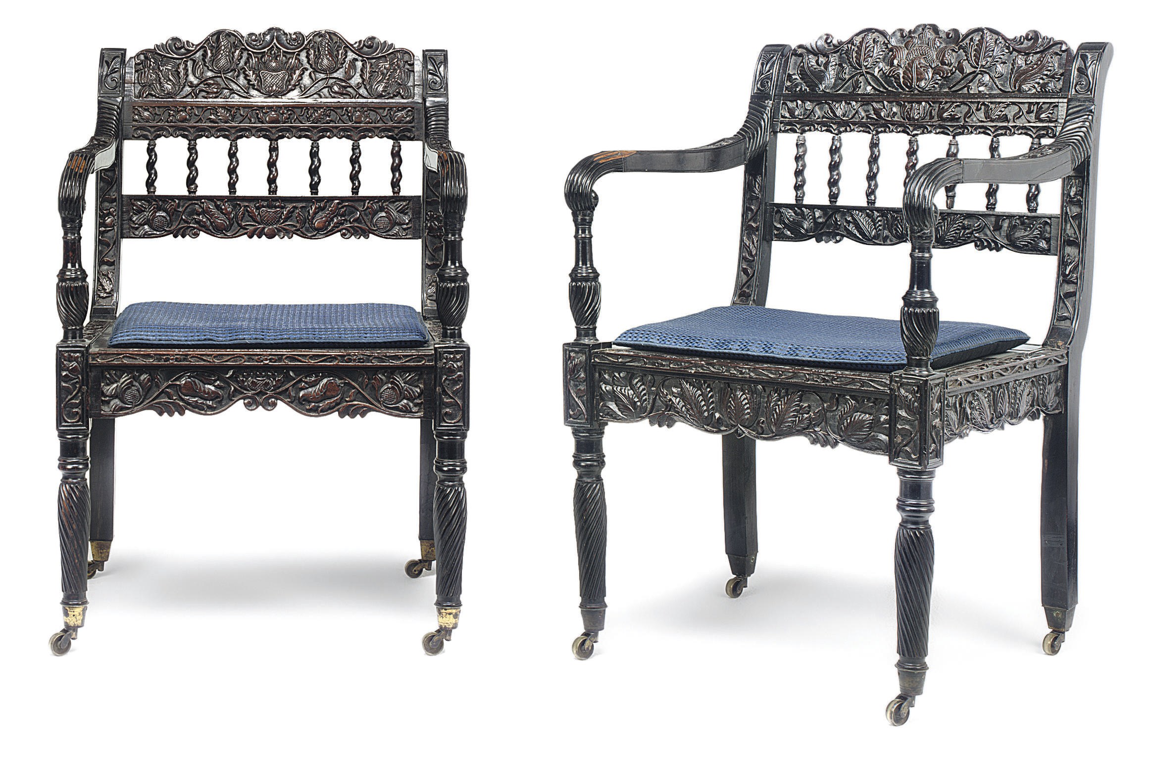 A PAIR OF ANGLO-INDIAN EBONY ARMCHAIRS