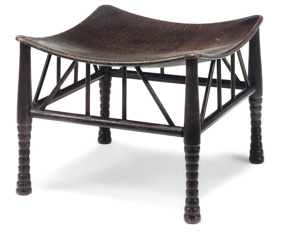 AN ARTS AND CRAFTS STAINED OAK 'THEBES' STOOL
