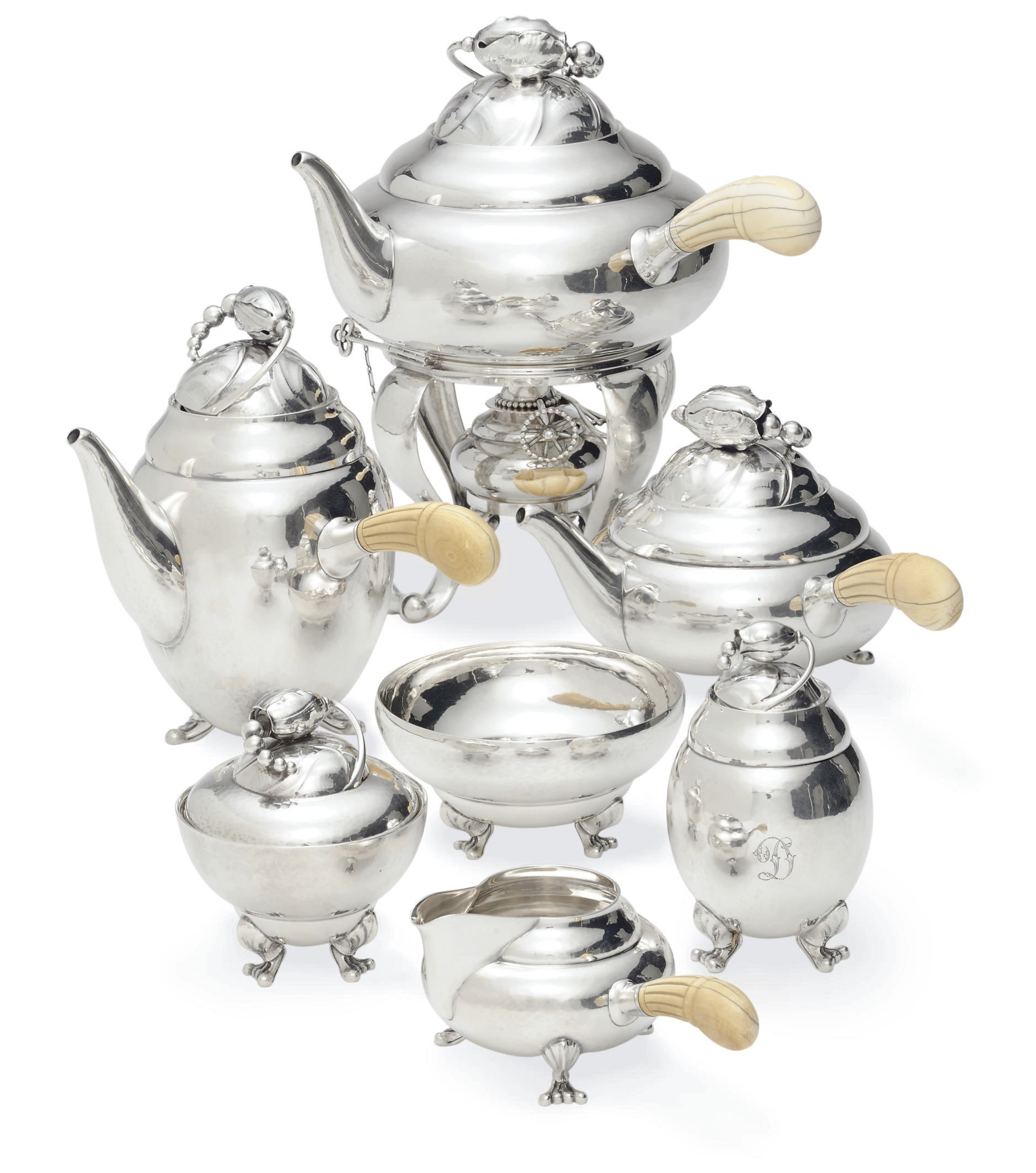 A DANISH SEVEN-PIECE SILVER TEA AND COFFEE SERVICE DESIGNED BY GEORG JENSEN**