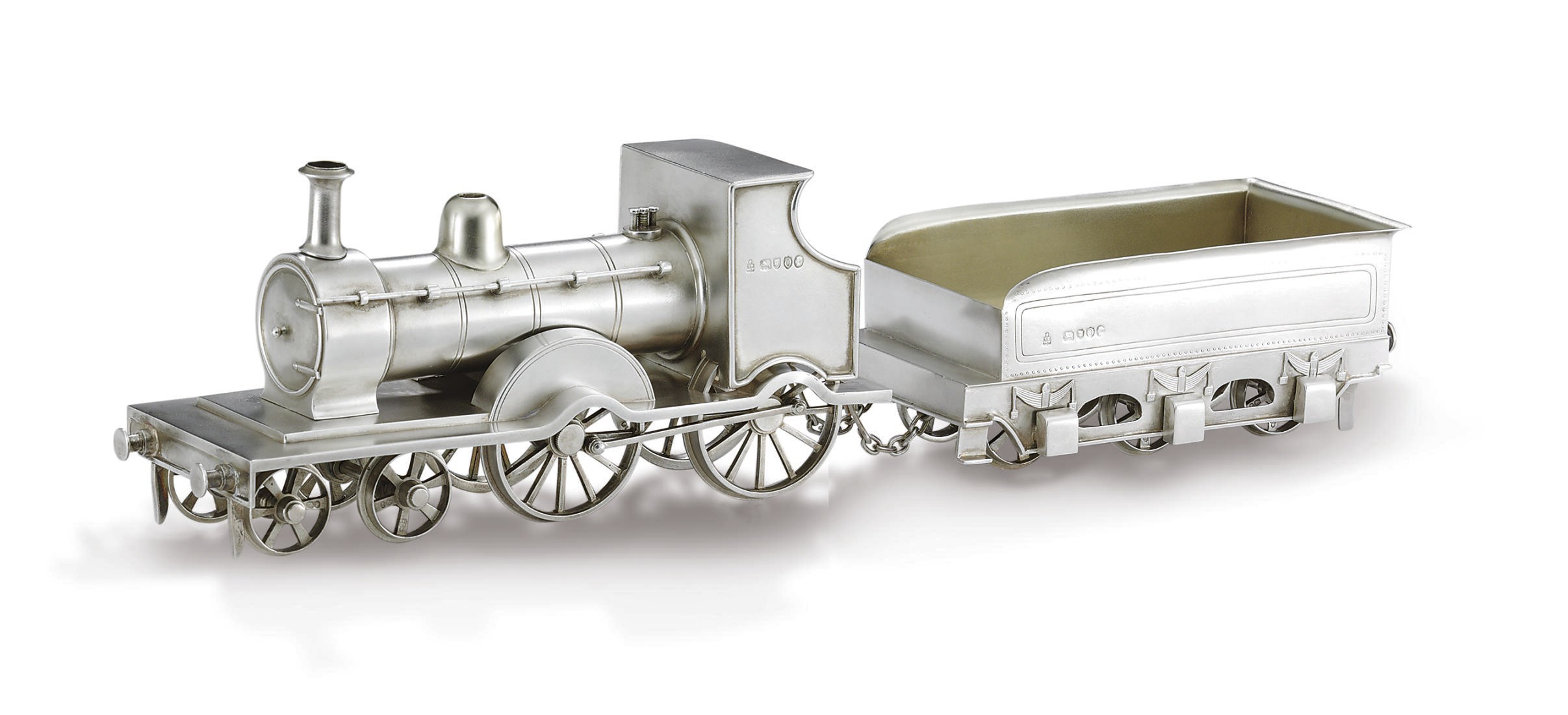 A VICTORIAN PARCEL-GILT SILVER LOCOMOTIVE