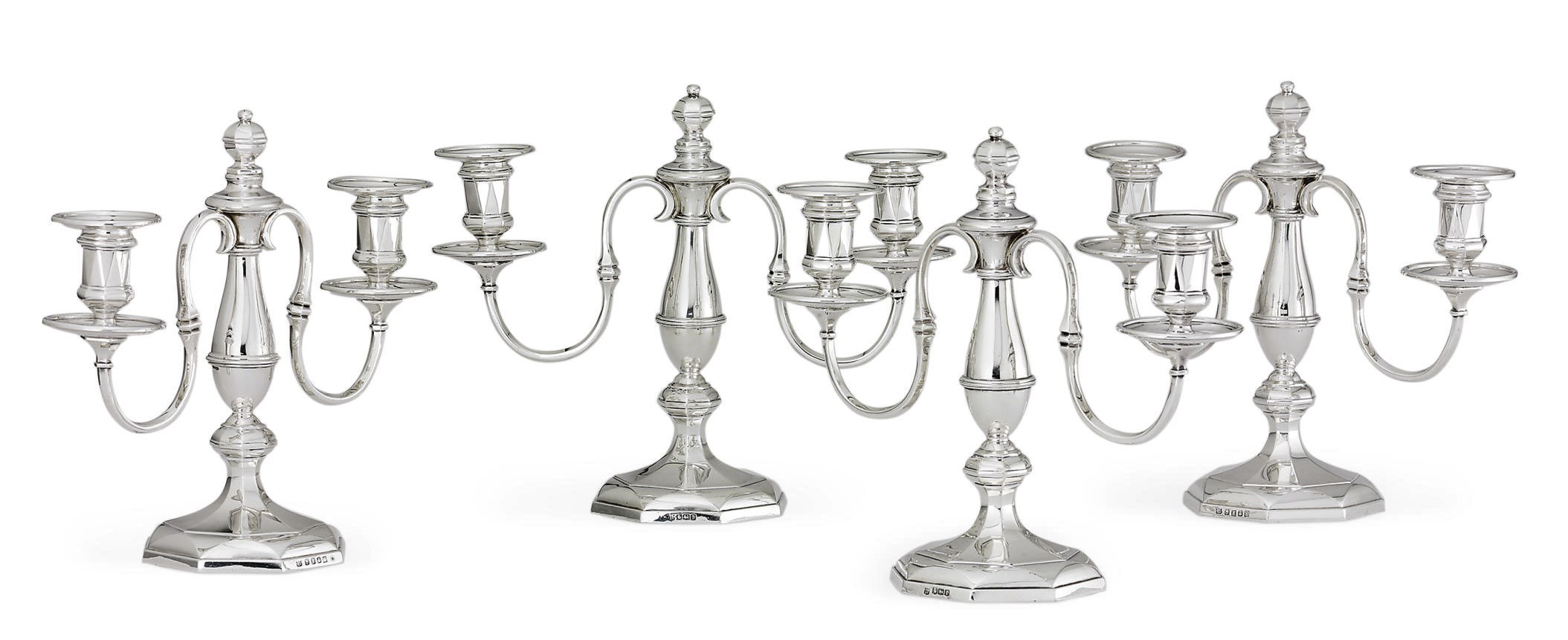 A SET OF FOUR GEORGE V SILVER TWO-LIGHT CANDELABRA