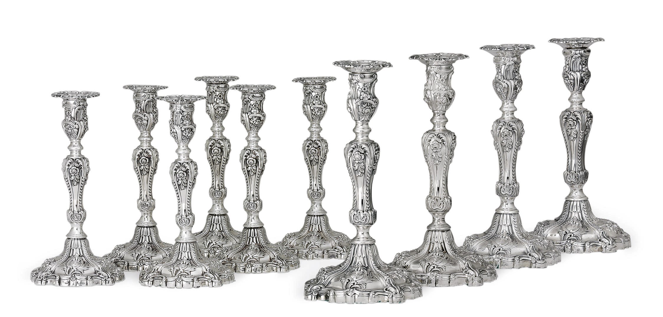 A SET OF TEN WILLIAM IV AND VICTORIAN SILVER CANDLESTICKS